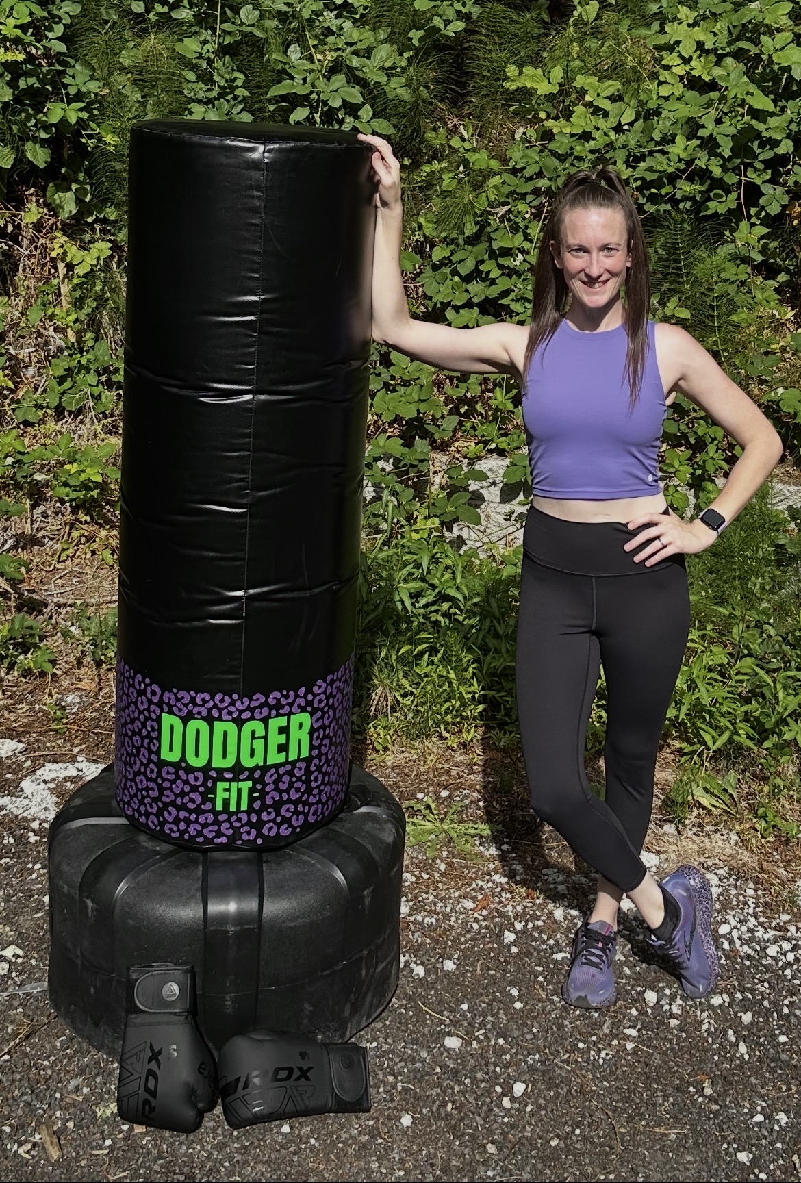 Dodger standing next to the DodgerFit kickboxing bag